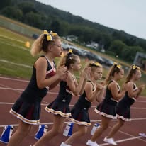 Titans cheerleaders performing a routine on the track