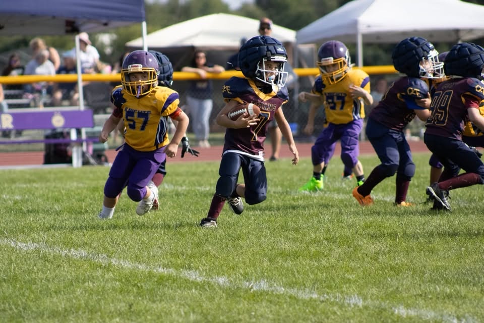 Titans runner cutting upfield with blockers ahead