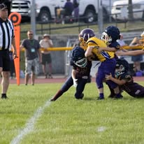 Titans football player being tackled during a game