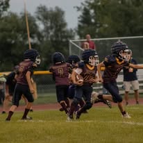 Group of young Titans football players running together