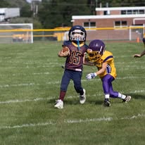 Titans ball carrier breaking away from a defender