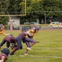 Titans football players making a tackle during a game