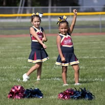 Two Titans cheerleaders cheering on the field