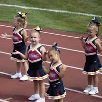 Littlest Titans cheerleaders performing on the track