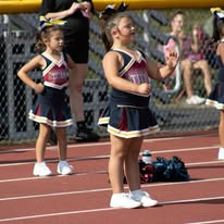 Titans cheerleaders standing on the track during a game