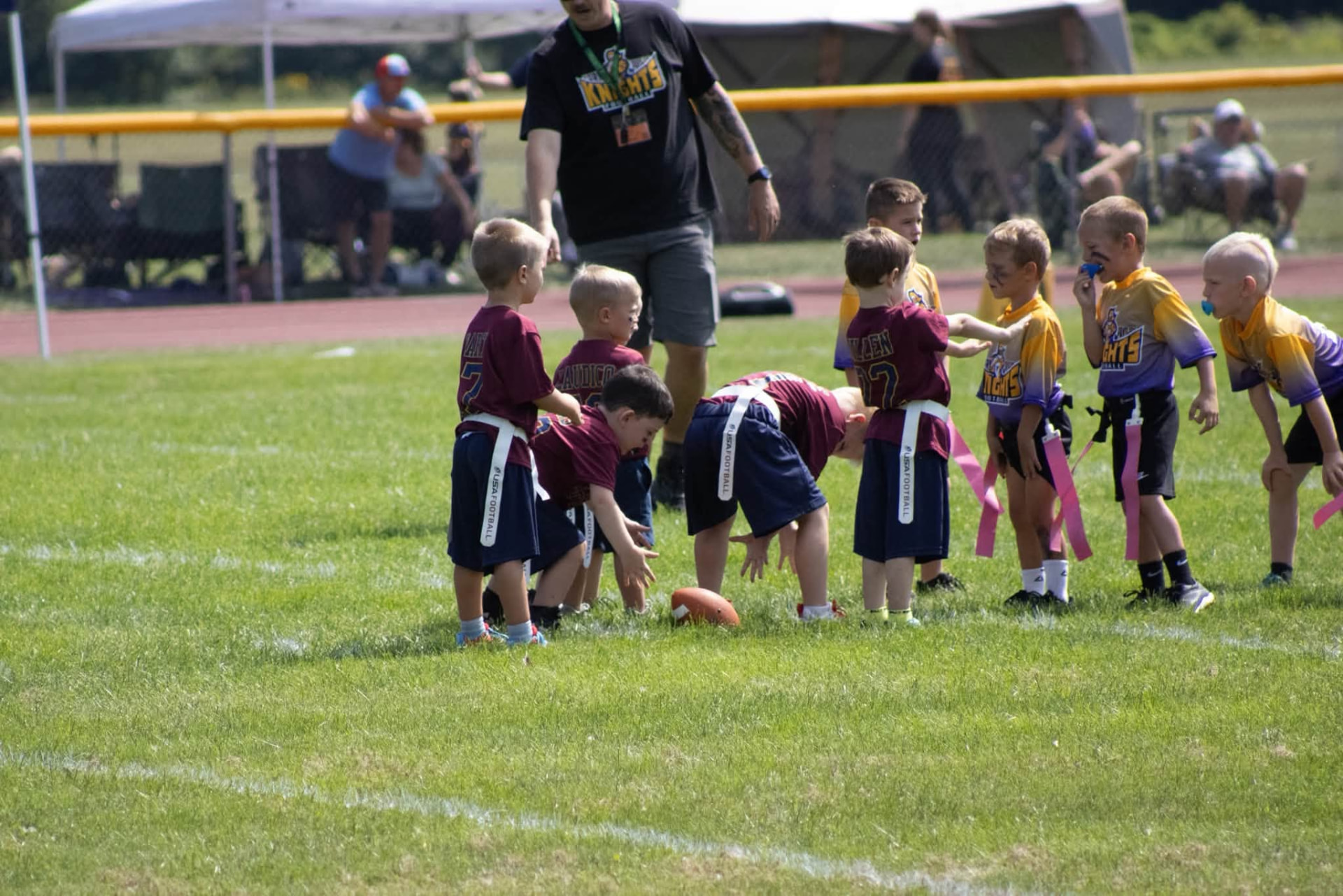 Flag football players lined up at the line of scrimmage