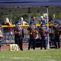 Titans football players standing under the team tent
