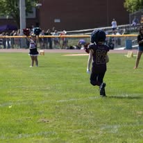 Young Titans football player running with the ball