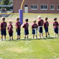 Young flag football players lined up on the field