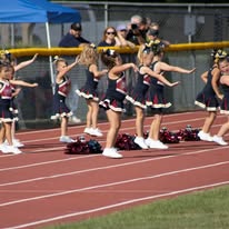 Titans cheerleaders performing a routine on the track