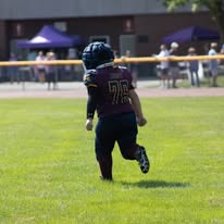 Titans player running onto the field on game day