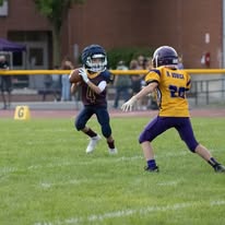Titans ball carrier running past a defender