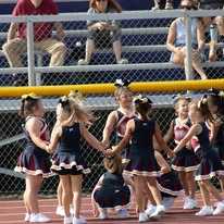 Titans cheerleaders in a circle on the track