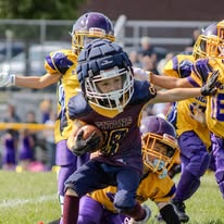 Titans football player being tackled during a game