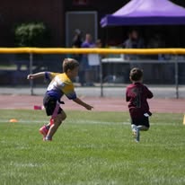 Flag football players racing down the field