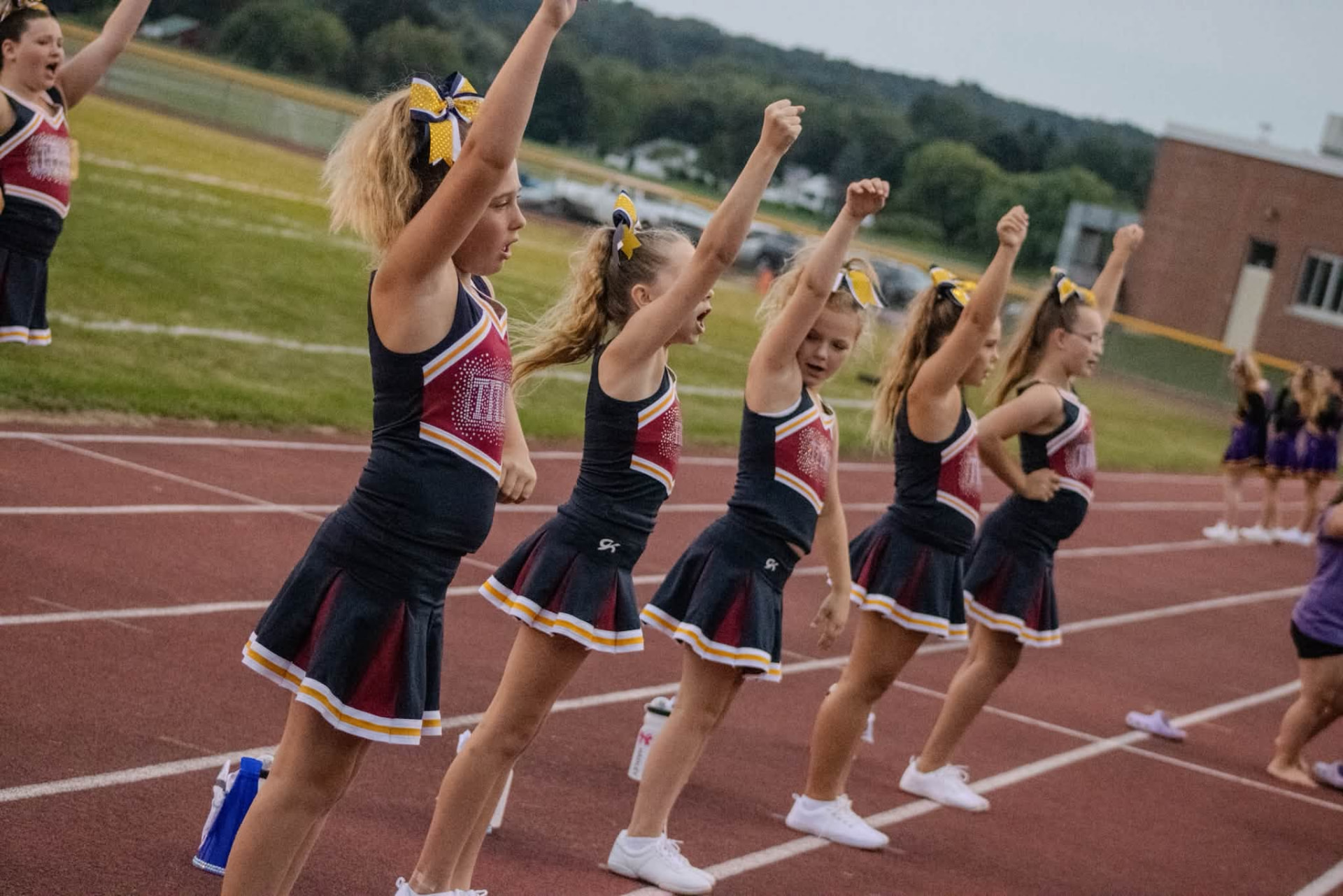 Titans cheer squad with arms raised in formation