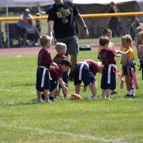 Young Titans flag football players at the line of scrimmage