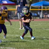 Titans tackle football player carrying the ball during a game