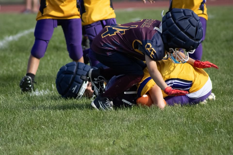 Titans defender making a tackle at the line