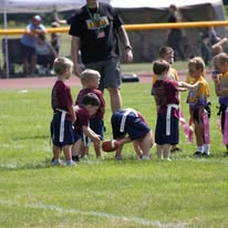 Young flag football players lined up at the line of scrimmage