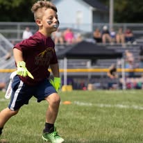 Young Titans flag football player running on the field