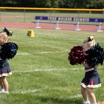 Titans cheerleaders with pom-poms on the field