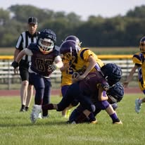 Titans football players making a tackle during a game